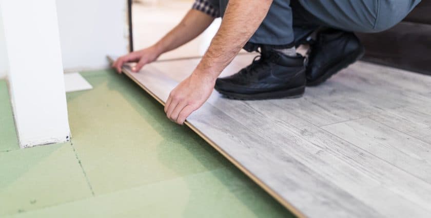 Laminate flooring installation with underlay and trim